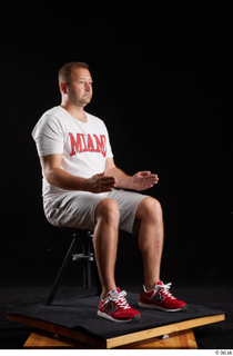  Louis  2 dressed grey shorts red sneakers sitting sports white t shirt whole body 0014.jpg